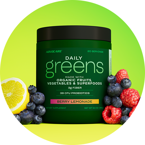 Daily Greens Berry Lemonade canister surrounded by sliced lemons and berries.