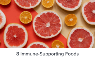 8 Immune-Supporting Foods - slices of oranges and grapefruits on an orange and white table.